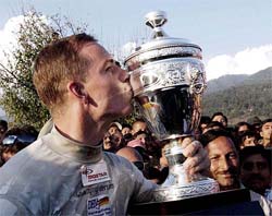 Norman Lausch of Germany kisses the trophy