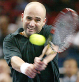 Andre Agassi of the USA returns a ball