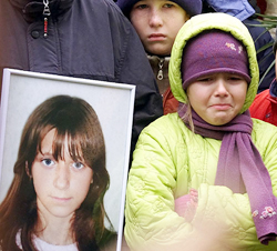 A young Russian girl weeps during the funeral of Kristina Kurbatova
