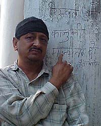 Indian National Lok Dal leader Naresh Bansal sits on a dharna outside 