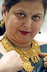 A woman tries on a necklace