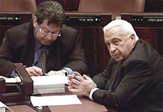 Defence Minister Binyamin Ben-Eliezer sitting with Israeli Prime Minister Ariel Sharon
