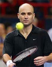 Andre Agassi of the USA plays with a ball