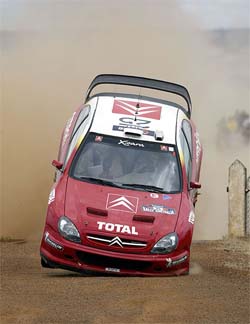 Sebastian Loeb of France flies his Citroen over a cattle grid
