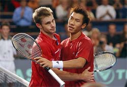 Paradorn Srichaphan of Thailand is congratulated by opponent Andy Roddick