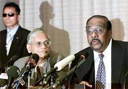 LTTE�s chief negotiator Anton Balasingham speaks alongside Sri Lankan Government�s chief negotiator G.L. Peiris during a news conference