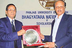 Prof K.N. Pathak, Vice-Chancellor, Panjab University, presents the Bhagyatara national award to Dr K.N. Ganesh, Deputy Director in the Division of Organic Chemistry at National Chemical Laboratory (Pune), in Chandigarh on Thursday.