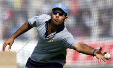 India's Yuvraj Singh reaches for the ball during a practise session 