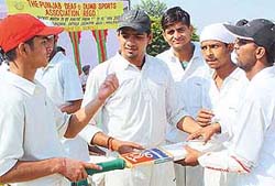 Members of the Delhi Deaf and Dumb cricket team plan strategy on the concluding day of the 5-day tournament held at PCA Stadium, SAS Nagar