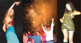 Jubilant crowds respond with raised hands as some models dance at a fashion show in the Satluj Club