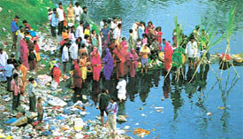 Devotees converge on the bank of the Yamuna for Chhat Puja on Sunday