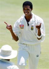 South African bowler Makhaya Ntini celebrates taking the wicket of Sri Lankan batsman Russel Arnold for a duck, on the third day of the first Test