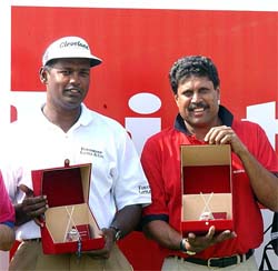 World number seven golfer Vijay Singh and former Indian cricket captain-turned-golfer Kapil Dev being presented with the mementos before the start of the Bilt Skins Golf Tournament at the DLF Course