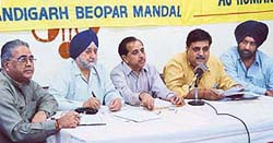 Members of the Chandigarh Beopar Mandal address a press conference against the recent amendments in the rent Act in Chandigarh on Monday