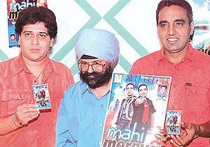 From left to right: Madan Shoki, music Director, with Ajit Sailani and singer Bai Amarjit at the release of cassette �Mahi Mereya�.
