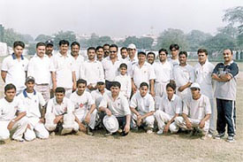 The Delhi and District Cricket Association staff teams with former Test player and Delhi Ranji Trophy team coach Yashpal Sharma 