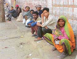 Beggars sit near Guru Nanak Stadium in Ludhiana 