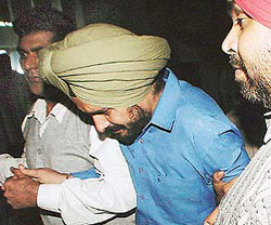 CBI seluths take SI Sarwan Singh for medical examination to General Hospital in Sector 16 of Chandigarh on Wednesday.