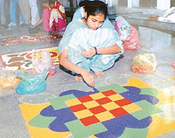 A student gives final touches to rangoli during a competition at the Ropar Zone Youth Festival at Government College, SAS Nagar, on Wednesday. 