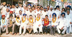 Akali workers, who were released from a Patiala jail, celebrate the victory of the SAD (Badal) group in the SGPC elections in Lalru Mandi.