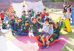 Tiny tots of Dikshant International School enjoy camping as part of the Children�s Day celebrations in Phase-I, Industrial Area, Panchkula, on Thursday.