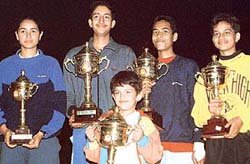 Players of different age groups with their trophies after winning the Total Tennis Championship in Mount Carmel School, Sector 47, Chandigarh