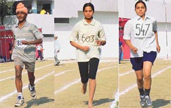 Dalvinder Singh from GNP School, Amandeep Kaur of GHGP School and Kamalpreet Kaur of GGN School on her way to win the gold medal in the Sahodya Inter-School Atheletics Meet