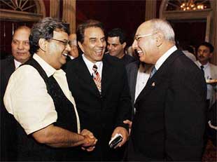 Herb Dhaliwal, Minister for Natural Resources, Canada, is greeted by showman Subhash Ghai and veteran actor Dharmendra