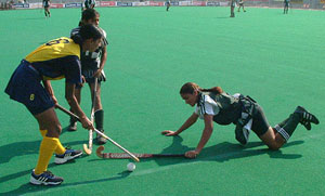 Northern Railway and Punjab XI players vie for the ball