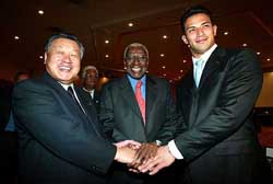 International Association of Athletics Federation president Lamine Diack congratulates former Japanese Prime Minister 