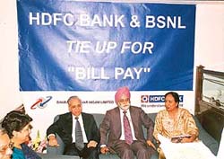 Mr Prithpal Singh, Chairman-cum-Managing Director, BSNL , Mr S.C. Chaudhary, Principal General Manager, BSNL, and Ms Neena Singh, Regional Head of HDFC Bank,