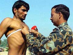 Chest measurement being carried out during an Army recruitment rally