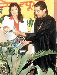 Former Miss World Yukta Mukhi and Chandrachud Singh planting saplings at National Victor Public School in the Capital