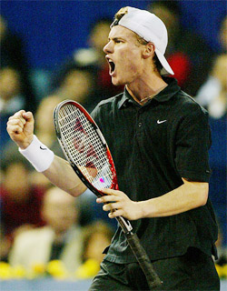 World number one Lleyton Hewitt of Australia celebrates after winning a point