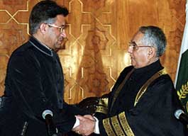 General Pervez Musharraf shakes hands with Chief Justice Sheikh Riaz Ahmed after taking oath as President for a new five-year term in Islamabad 