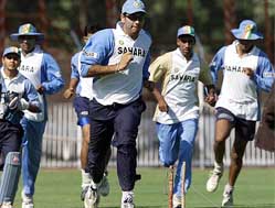 Indian players warm up during a practice session in Baroda on Sunday ahead of the fifth one-day international match against the West Indies