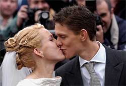Belgian tennis player Justine Henin kisses her husband