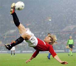 Roma's Antonio Cassano pelts a reverse over-head kick