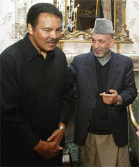 Afghan President Hamid Karzai greets boxing legend Muhammad Ali
