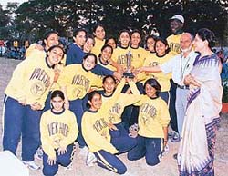 Girls of Vivek High School, Sector 38, with the Inter-School CBSE Athletics Championship trophy along with Principal P.K. Singh and coach W.W.O. Kuku