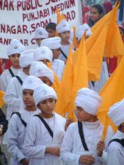 Traditionally-dressed kids participate in a nagar kirtan