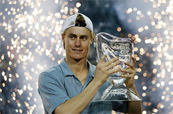 World No 1 Lleyton Hewitt of Australia holds the trophy after beating Juan Carlos Ferrero of Spain in the final of the Tennis Masters cup