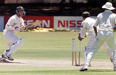 Zimbabwe batsman Andy Blignaut tries to make his crease as he is stumped by Pakistan wicketkeeper