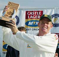 South African captain Shaun Pollock holds up the trophy