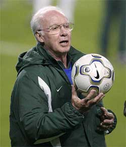 Brazil's football coach Mario Zagallo holds the ball during a training session in Seoul