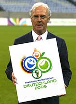 President of the World Cup Organizing Committee Franz Beckenbauer displays the logo of the 2006 FIFA World Cup