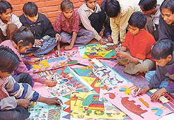 Slum kids of Janata Colony busy making designs for greeting cards at Government High School, Sector 24, Chandigarh.