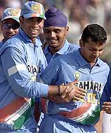 Indian bowler Murli Kartik is congratulated by teammates