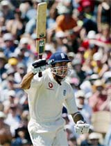 England's opening batsman Michael Vaughan punches the air