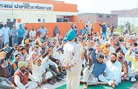 Villagers at a rally held on Thursday to protest against the prohibition drive launched by the Zirakpur Nagar Panchayat to restrict construction within a radius of 900 metres from the defence installation in this area.